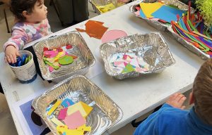 Children explore art materials in a previous Little Artists Session, July 2025